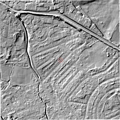 Shaded relief map of the ground around M308LA, computed from Environment Agency LiDAR. The ground here sits at about 21 m above sea level and falls 14 m across the surrounding 800 m. Surface water reaching this point runs off ground lying to the east, 1.7 m higher.