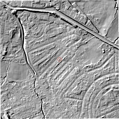 Shaded relief map of the ground around M308LB, computed from Environment Agency LiDAR. The ground here sits at about 21 m above sea level and falls 11 m across the surrounding 800 m. Surface water reaching this point runs off ground lying to the east-north-east, 1.7 m higher.