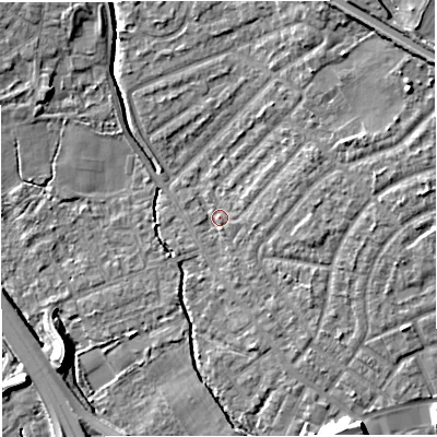 Shaded relief map of the ground around M308LF, computed from Environment Agency LiDAR. The ground here sits at about 21 m above sea level and falls 11 m across the surrounding 800 m. Surface water reaching this point runs off ground lying to the north-east, 6.6 m higher.