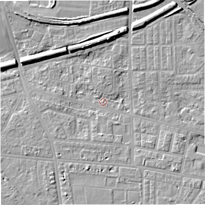 Shaded relief map of the ground around M320AT, computed from Environment Agency LiDAR. The ground here sits at about 24 m above sea level and falls 8 m across the surrounding 800 m. Surface water reaching this point runs off ground lying to the north-north-east, 7.9 m higher.