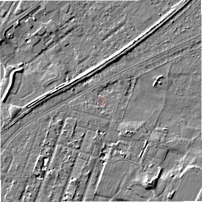 Shaded relief map of the ground around M328GL, computed from Environment Agency LiDAR. The ground here sits at about 26 m above sea level and falls 8 m across the surrounding 800 m. Surface water reaching this point runs off ground lying to the south-east, 3.1 m higher.
