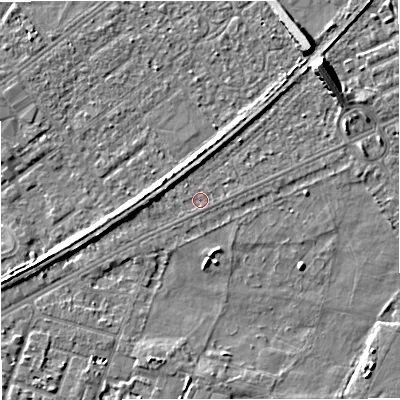 Shaded relief map of the ground around M328GW, computed from Environment Agency LiDAR. The ground here sits at about 26 m above sea level and falls 8 m across the surrounding 800 m. Surface water reaching this point runs off ground lying to the north-east, 6.8 m higher.