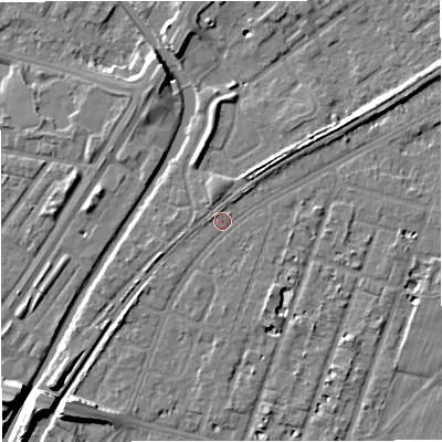 Shaded relief map of the ground around M328JT, computed from Environment Agency LiDAR. The ground here sits at about 27 m above sea level and falls 11 m across the surrounding 800 m. Surface water reaching this point runs off ground lying to the south-west, 5.3 m higher.