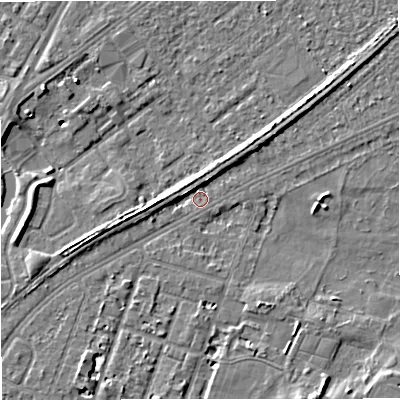 Shaded relief map of the ground around M328QW, computed from Environment Agency LiDAR. The ground here sits at about 26 m above sea level and falls 7 m across the surrounding 800 m. Surface water reaching this point runs off ground lying to the north-east, 3.6 m higher.
