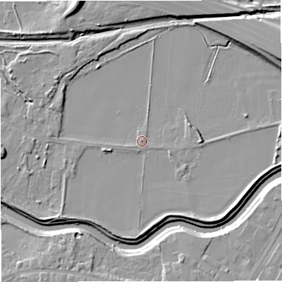 Shaded relief map of the ground around M328RH, computed from Environment Agency LiDAR. The ground here sits at about 21 m above sea level and falls 12 m across the surrounding 800 m. Surface water reaching this point runs off ground lying to the east-north-east, 9.5 m higher.