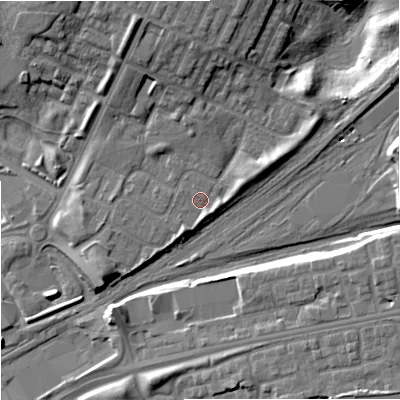 Shaded relief map of the ground around M405LG, computed from Environment Agency LiDAR. The ground here sits at about 81 m above sea level and falls 16 m across the surrounding 800 m. Surface water reaching this point runs off ground lying to the east-north-east, 3.1 m higher.