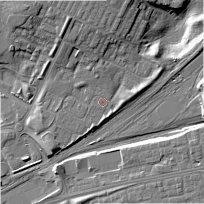 Shaded relief map of the ground around M405LU, computed from Environment Agency LiDAR. The ground here sits at about 81 m above sea level and falls 17 m across the surrounding 800 m. Surface water reaching this point runs off ground lying to the north, 7.0 m higher.