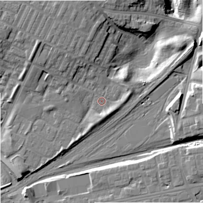 Shaded relief map of the ground around M405LX, computed from Environment Agency LiDAR. The ground here sits at about 81 m above sea level and falls 21 m across the surrounding 800 m. Surface water reaching this point runs off ground lying to the north-north-west, 7.0 m higher.