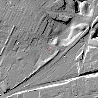 Shaded relief map of the ground around M405NX, computed from Environment Agency LiDAR. The ground here sits at about 81 m above sea level and falls 23 m across the surrounding 800 m. Surface water reaching this point runs off ground lying to the north-west, 2.3 m higher.
