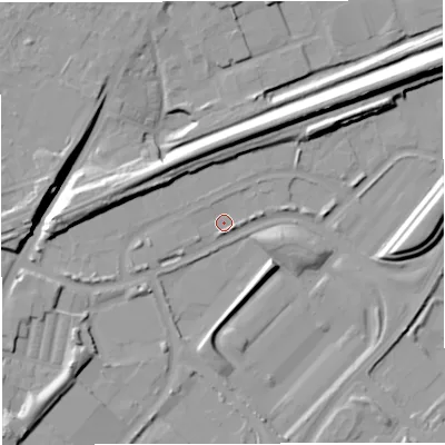 Shaded relief map of the ground around M445EG, computed from Environment Agency LiDAR. The ground here sits at about 16 m above sea level and falls 16 m across the surrounding 800 m. Surface water reaching this point runs off ground lying to the north, 12.9 m higher.