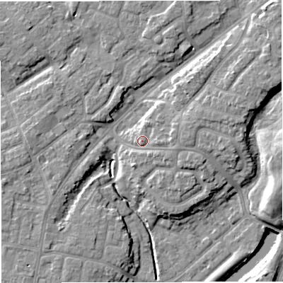 Shaded relief map of the ground around M446DB, computed from Environment Agency LiDAR. The ground here sits at about 19 m above sea level and falls 11 m across the surrounding 800 m. Surface water reaching this point runs off ground lying to the east, 2.7 m higher.