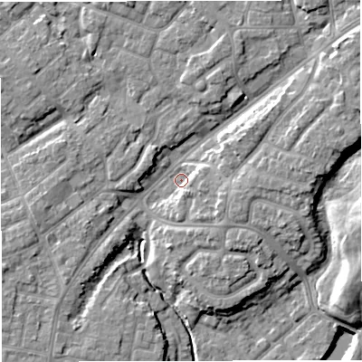 Shaded relief map of the ground around M446DP, computed from Environment Agency LiDAR. The ground here sits at about 16 m above sea level and falls 11 m across the surrounding 800 m. Surface water reaching this point runs off ground lying to the east-north-east, 6.5 m higher.