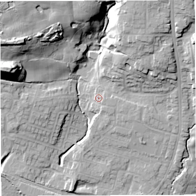 Shaded relief map of the ground around M469LW, computed from Environment Agency LiDAR. The ground here sits at about 75 m above sea level and falls 35 m across the surrounding 800 m. Surface water reaching this point runs off ground lying to the south-east, 3.1 m higher.