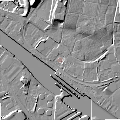 Shaded relief map of the ground around M502UE, computed from Environment Agency LiDAR. The ground here sits at about 22 m above sea level and falls 30 m across the surrounding 800 m. Surface water reaching this point runs off ground lying to the north, 12.9 m higher.