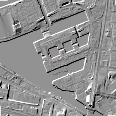 Shaded relief map of the ground around M503XG, computed from Environment Agency LiDAR. The ground here sits at about 24 m above sea level and falls 8 m across the surrounding 800 m. Surface water reaching this point runs off ground lying to the east, 2.1 m higher.