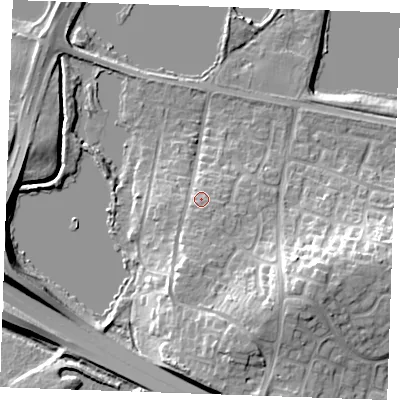 Shaded relief map of the ground around ME206HX, computed from Environment Agency LiDAR. The ground here sits at about 12 m above sea level and falls 19 m across the surrounding 800 m. Surface water reaching this point runs off ground lying to the south, 2.1 m higher.