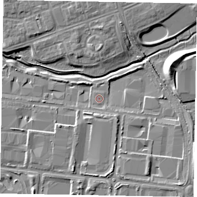 Shaded relief map of the ground around MK100BD, computed from Environment Agency LiDAR. The ground here sits at about 63 m above sea level and falls 12 m across the surrounding 800 m. The ground contributing surface water to this point lies to the south.