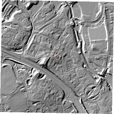 Shaded relief map of the ground around MK109NW, computed from Environment Agency LiDAR. The ground here sits at about 63 m above sea level and falls 11 m across the surrounding 800 m. Surface water reaching this point runs off ground lying to the west, 1.8 m higher.