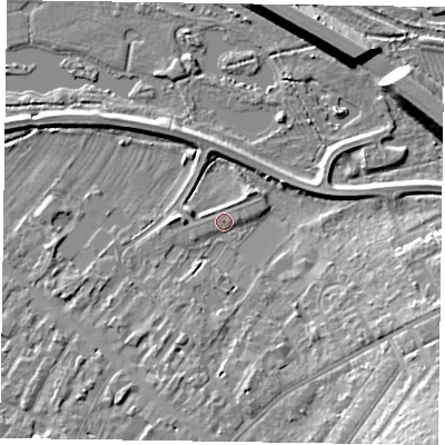 Shaded relief map of the ground around MK111PW, computed from Environment Agency LiDAR. The ground here sits at about 65 m above sea level and falls 14 m across the surrounding 800 m. Surface water reaching this point runs off ground lying to the south-east, 9.4 m higher.