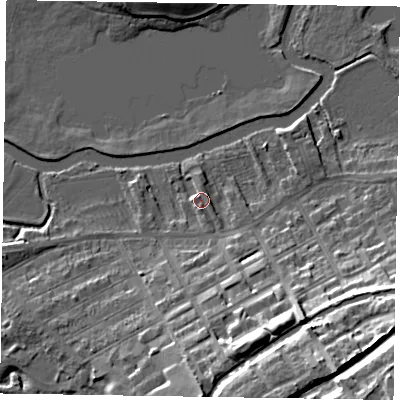 Shaded relief map of the ground around MK130AX, computed from Environment Agency LiDAR. The ground here sits at about 62 m above sea level and falls 24 m across the surrounding 800 m. Surface water reaching this point runs off ground lying to the south, 10.5 m higher.