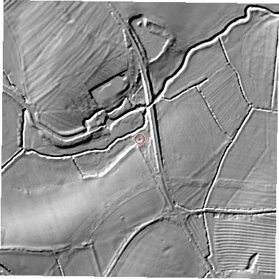 Shaded relief map of the ground around MK184DZ, computed from Environment Agency LiDAR. The ground here sits at about 82 m above sea level and falls 8 m across the surrounding 800 m. Surface water reaching this point runs off ground lying to the south, 3.2 m higher.