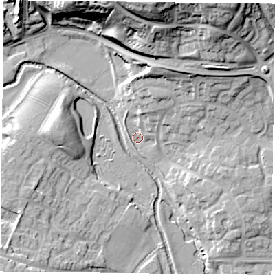 Shaded relief map of the ground around MK187BP, computed from Environment Agency LiDAR. The ground here sits at about 77 m above sea level and falls 33 m across the surrounding 800 m. Surface water reaching this point runs off ground lying to the north-north-east, 7.4 m higher.