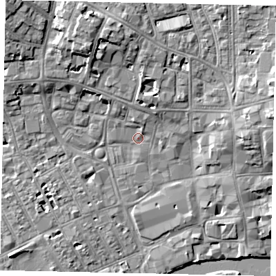 Shaded relief map of the ground around MK401LX, computed from Environment Agency LiDAR. The ground here sits at about 28 m above sea level and falls 11 m across the surrounding 800 m. Surface water reaching this point runs off ground lying to the north, 3.7 m higher.