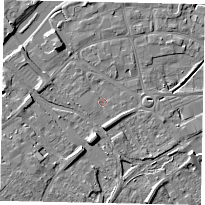 Shaded relief map of the ground around MK429AX, computed from Environment Agency LiDAR. The ground here sits at about 26 m above sea level and falls 9 m across the surrounding 800 m. Surface water reaching this point runs off ground lying to the south, 6.3 m higher.