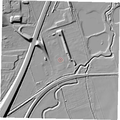 Shaded relief map of the ground around MK443SB, computed from Environment Agency LiDAR. The ground here sits at about 23 m above sea level and falls 11 m across the surrounding 800 m. Surface water reaching this point runs off ground lying to the north-west, 9.9 m higher.