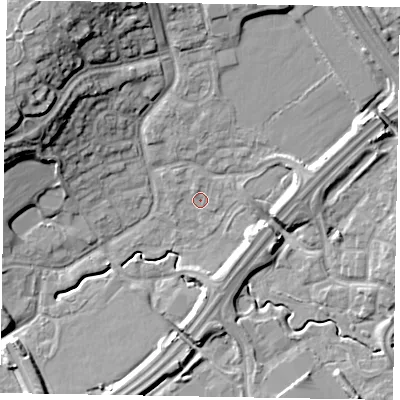 Shaded relief map of the ground around MK77BP, computed from Environment Agency LiDAR. The ground here sits at about 69 m above sea level and falls 20 m across the surrounding 800 m. Surface water reaching this point runs off ground lying to the north-north-east, 8.6 m higher.