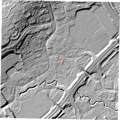 Shaded relief map of the ground around MK77BQ, computed from Environment Agency LiDAR. The ground here sits at about 69 m above sea level and falls 20 m across the surrounding 800 m. Surface water reaching this point runs off ground lying to the north-west, 0.6 m higher.