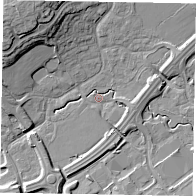 Shaded relief map of the ground around MK77DE, computed from Environment Agency LiDAR. The ground here sits at about 68 m above sea level and falls 21 m across the surrounding 800 m. Surface water reaching this point runs off ground lying to the south-east, 6.1 m higher.