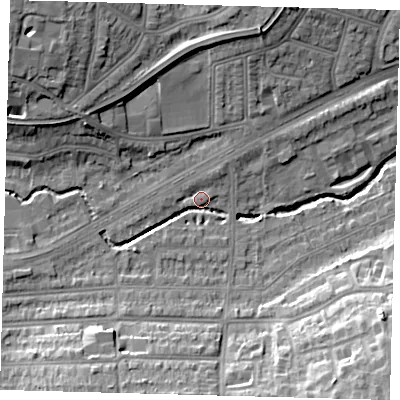 Shaded relief map of the ground around N136AQ, computed from Environment Agency LiDAR. The ground here sits at about 24 m above sea level and falls 19 m across the surrounding 800 m. Surface water reaching this point runs off ground lying to the north-west, 17.6 m higher.
