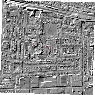 Shaded relief map of the ground around N182AX, computed from Environment Agency LiDAR. The ground here sits at about 12 m above sea level and falls 9 m across the surrounding 800 m. Surface water reaching this point runs off ground lying to the south-west, 1.4 m higher.