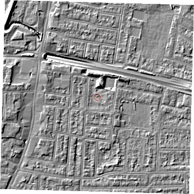 Shaded relief map of the ground around N182JQ, computed from Environment Agency LiDAR. The ground here sits at about 12 m above sea level and falls 13 m across the surrounding 800 m. Surface water reaching this point runs off ground lying to the north-west, 1.4 m higher.