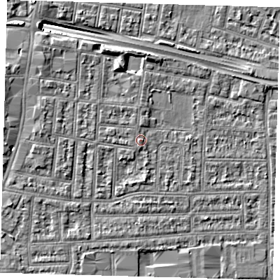 Shaded relief map of the ground around N182JS, computed from Environment Agency LiDAR. The ground here sits at about 13 m above sea level and falls 10 m across the surrounding 800 m. Surface water reaching this point runs off ground lying to the west-north-west, 1.3 m higher.