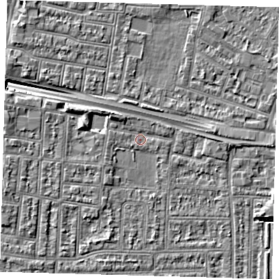 Shaded relief map of the ground around N182JU, computed from Environment Agency LiDAR. The ground here sits at about 12 m above sea level and falls 9 m across the surrounding 800 m. Surface water reaching this point runs off ground lying to the west-north-west, 3.6 m higher.
