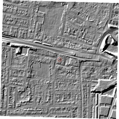 Shaded relief map of the ground around N182LQ, computed from Environment Agency LiDAR. The ground here sits at about 12 m above sea level and falls 7 m across the surrounding 800 m. Surface water reaching this point runs off ground lying to the west, 3.6 m higher.