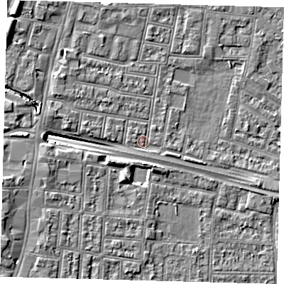 Shaded relief map of the ground around N182PL, computed from Environment Agency LiDAR. The ground here sits at about 12 m above sea level and falls 13 m across the surrounding 800 m. Surface water reaching this point runs off ground lying to the north-west, 13.1 m higher.