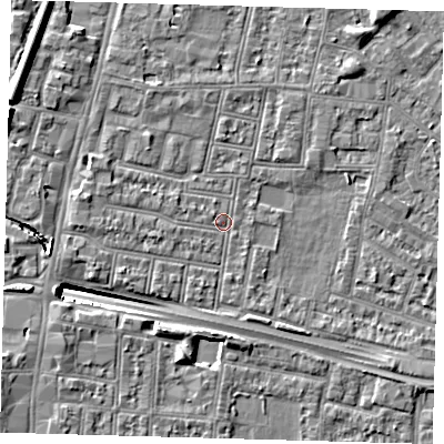 Shaded relief map of the ground around N182QR, computed from Environment Agency LiDAR. The ground here sits at about 12 m above sea level and falls 13 m across the surrounding 800 m. Surface water reaching this point runs off ground lying to the west-north-west, 6.3 m higher.