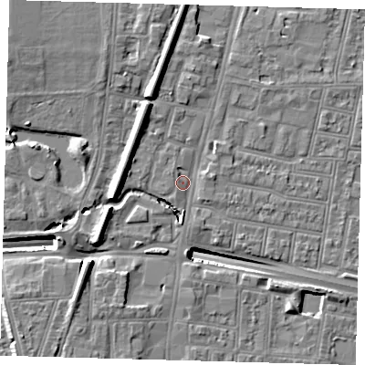 Shaded relief map of the ground around N182TZ, computed from Environment Agency LiDAR. The ground here sits at about 13 m above sea level and falls 13 m across the surrounding 800 m. Surface water reaching this point runs off ground lying to the south, 2.1 m higher.