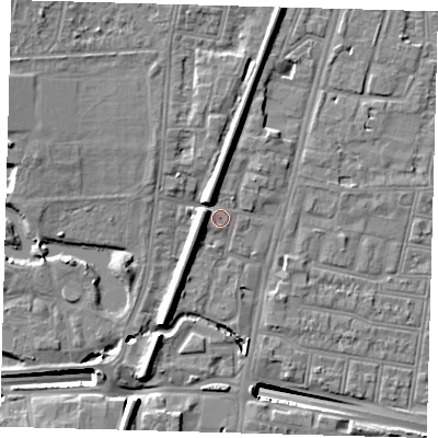 Shaded relief map of the ground around N182UT, computed from Environment Agency LiDAR. The ground here sits at about 14 m above sea level and falls 14 m across the surrounding 800 m. Surface water reaching this point runs off ground lying to the north-west, 4.7 m higher.