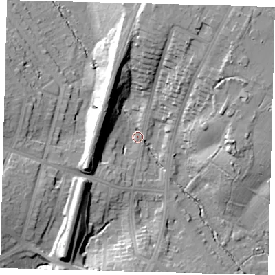 Shaded relief map of the ground around N212EE, computed from Environment Agency LiDAR. The ground here sits at about 26 m above sea level and falls 25 m across the surrounding 800 m. Surface water reaching this point runs off ground lying to the north, 24.5 m higher.