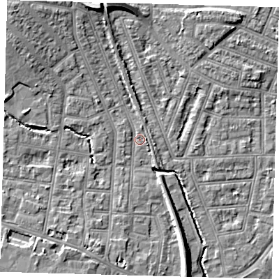 Shaded relief map of the ground around N99DQ, computed from Environment Agency LiDAR. The ground here sits at about 16 m above sea level and falls 11 m across the surrounding 800 m. Surface water reaching this point runs off ground lying to the north-north-west, 7.4 m higher.