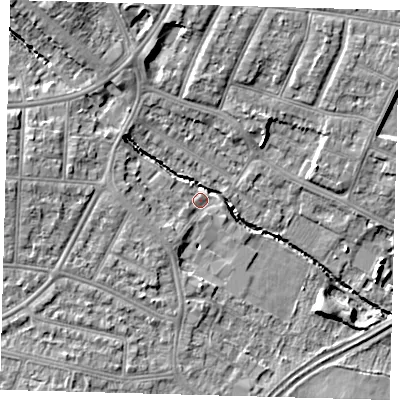 Shaded relief map of the ground around N99JX, computed from Environment Agency LiDAR. The ground here sits at about 21 m above sea level and falls 10 m across the surrounding 800 m. Surface water reaching this point runs off ground lying to the west, 7.9 m higher.