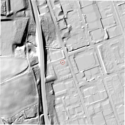 Shaded relief map of the ground around NE110PZ, computed from Environment Agency LiDAR. The ground here sits at about 14 m above sea level and falls 37 m across the surrounding 800 m. Surface water reaching this point runs off ground lying to the north-west, 8.7 m higher.