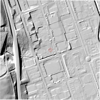 Shaded relief map of the ground around NE110TU, computed from Environment Agency LiDAR. The ground here sits at about 13 m above sea level and falls 33 m across the surrounding 800 m. Surface water reaching this point runs off ground lying to the west-north-west, 6.0 m higher.