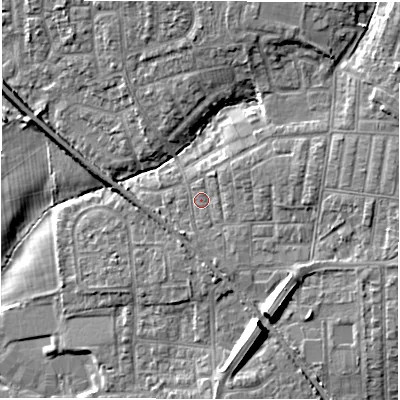 Shaded relief map of the ground around NE127JN, computed from Environment Agency LiDAR. The ground here sits at about 57 m above sea level and falls 13 m across the surrounding 800 m. Surface water reaching this point runs off ground lying to the east-north-east, 3.7 m higher.