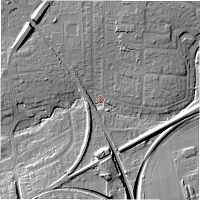 Shaded relief map of the ground around NE129JU, computed from Environment Agency LiDAR. The ground here sits at about 56 m above sea level and falls 13 m across the surrounding 800 m. Surface water reaching this point runs off ground lying to the south-east, 3.4 m higher.