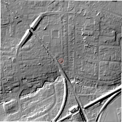 Shaded relief map of the ground around NE129JX, computed from Environment Agency LiDAR. The ground here sits at about 58 m above sea level and falls 13 m across the surrounding 800 m. Surface water reaching this point runs off ground lying to the north-north-east, 3.2 m higher.